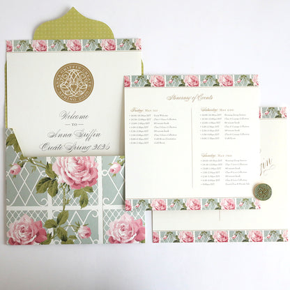 The Anna Griffin | Create Spring 2026 suite includes gold-sealed, floral invitations, an event schedule, and a card with pink roses and green envelopes—perfect for scrapbooking inspiration and styled on a crisp white surface.