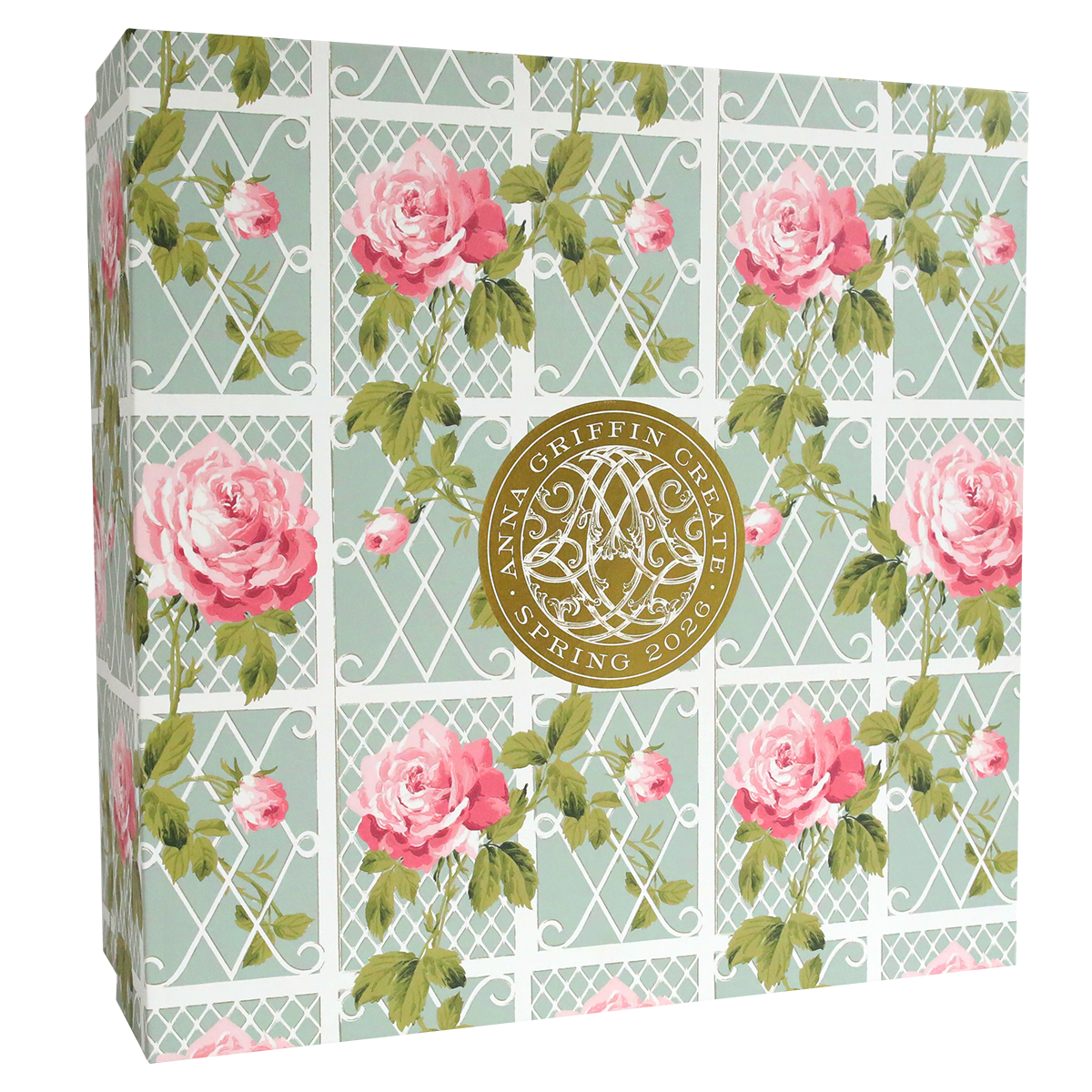 Square decorative box with pink and green lattice and rose floral pattern, featuring a gold "Anna Griffin | Create Spring 2026" seal—perfect for storing keepsakes from papercrafting events or online crafting classes.