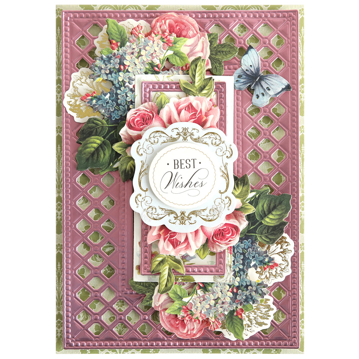 A decorative greeting card featuring pink florals, green leaves, a blue butterfly, and "Best Wishes" on a pink patterned background, elegantly crafted with Create Spring Frame Dies for intricate detail.