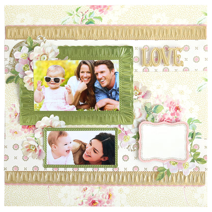 A scrapbook page featuring two family photos, floral decor, gold accents, "LOVE" text, dimension from the Create Border, Frame and Shape Dies, and a blank label for your message.