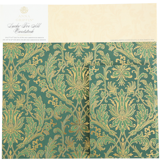 Lucky for All Double Sided Cardstock features intricate gold foil floral and botanical patterns on green sheets, packaged under the label “Anna Griffin, Lucky For All, Cardstock.” Ideal for elegant scrapbook paper projects.