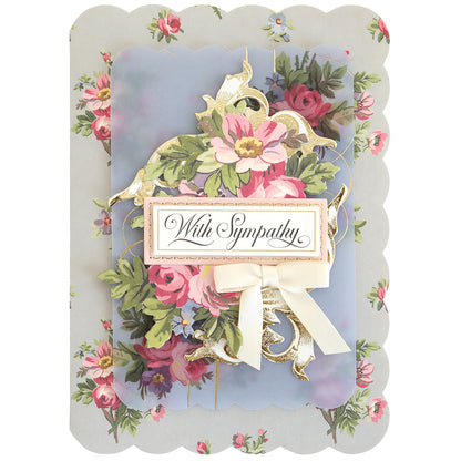 The Simply Sympathy Card Making Kit includes floral patterns, scalloped edges, a "With Sympathy" message, cream ribbon, and layered flower designs—ideal for fans of handmade sympathy cards or card making supplies.
