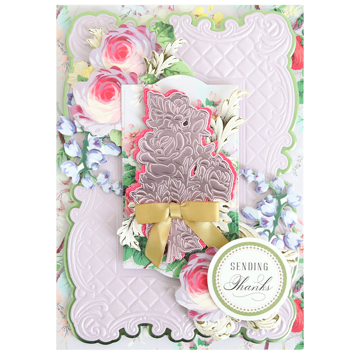A decorative greeting card with embossed pink patterns, floral designs made using the Tufted Rose Concentric Frames 3D Die Set, a gold bow, and a round label that reads "SENDING Thanks.