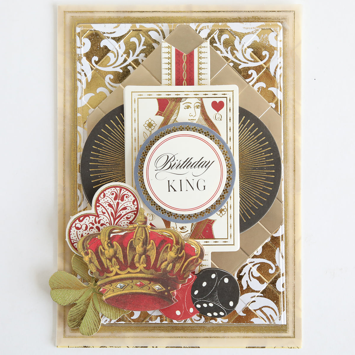 Greeting card made from 260 gsm Ivory Coated Cardstock featuring decorative gold patterns, a playing card motif, crown, dice, and a "Birthday King" label in the center with hot foil accents.