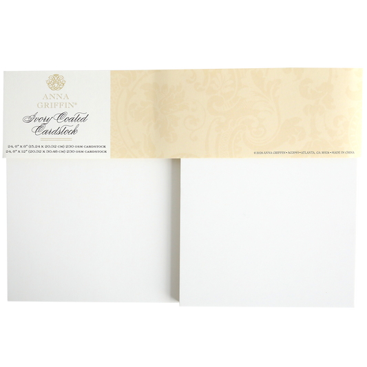 A photo of Ivory Coated Cardstock, showing a pack with two blank 260 gsm sheets and a beige decorative label with gold text at the top.