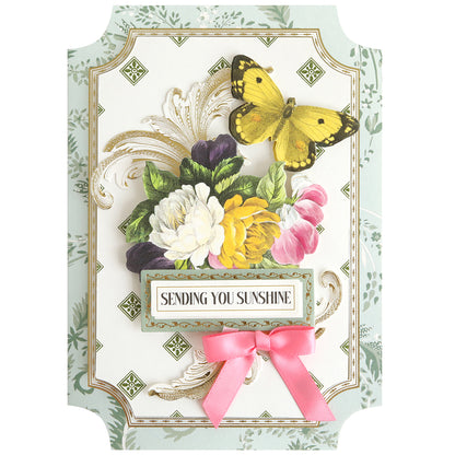 Handmade card from the Simply Summer Card Making Kit with a yellow butterfly, colorful flowers, pink ribbon bow, and "Sending You Sunshine" text—perfect for brightening anyone's day.
