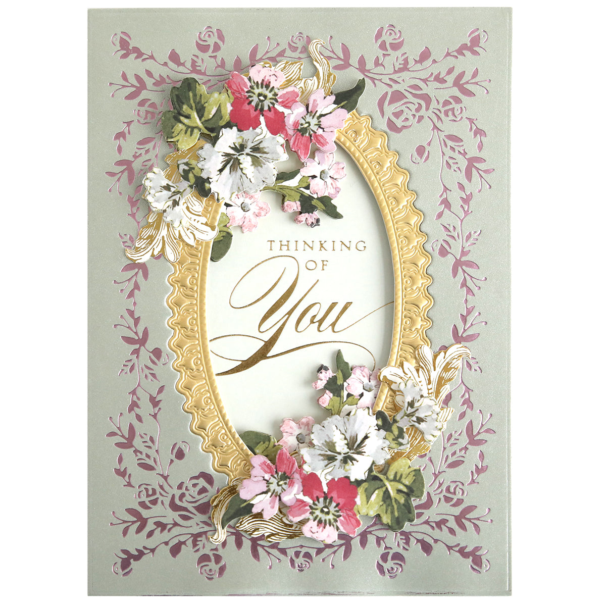 The Rose Garden Frame and Sentiment Gilded Foil Frame Plates create a decorative greeting card with a gold rose frame, floral accents, and "Thinking of You" on a pale pink vine background—ideal for elegant paper crafts.