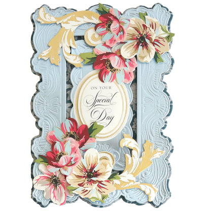 A decorative card made from Luxury Hydrangea Blue Matte Foil Cardstock, featuring embossed blue edges, gold accents, blooming hydrangeas, and "On Your Special Day" in a central oval.