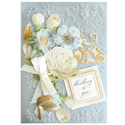 The Luxury Hydrangea Blue Matte Foil Cardstock greeting card features embossed floral patterns, blooming hydrangeas in white and blue, a cream bow, gold accents, and a "thinking of you" tag on elegant blue cardstock.