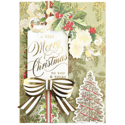 Get inspired for your next holiday project with the Christmas Grace Card Making Kit, featuring handmade cards with gold "A Very Merry Christmas to You & Yours" script, holly, striped bows, and pine tree illustrations.