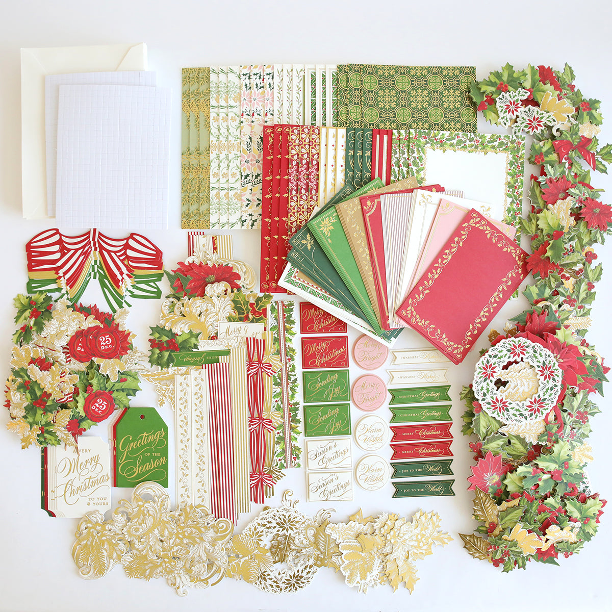 The Christmas Grace Card Making Kit offers patterned papers, envelopes, tags, cutouts, bows, and festive floral embellishments—perfect for creating handmade holiday cards or enhancing your Christmas card kit.