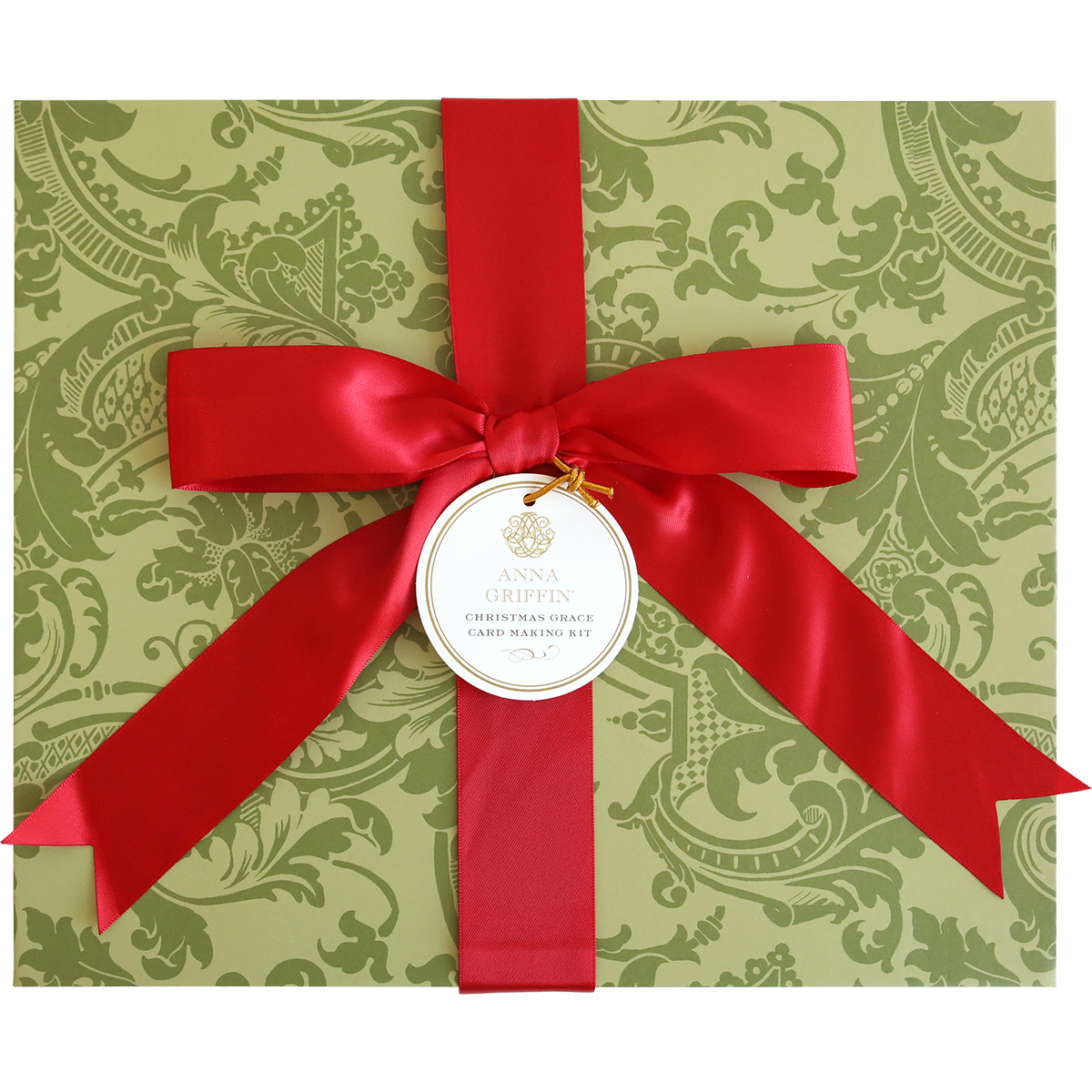 A green patterned box with a large red ribbon and bow, featuring a round tag labeled "Christmas Grace Card Making Kit"—perfect for creating beautiful handmade Christmas cards with this festive holiday set.
