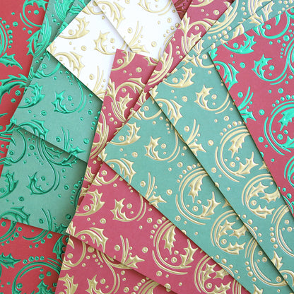 Christmas Grace Tonal Foil Card Stock features embossed red, green, and white sheets with metallic holly and swirl patterns—ideal for holiday card making or adding festive flair to your Christmas projects.