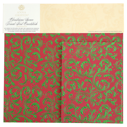 Christmas Grace Tonal Foil Card Stock features red sheets with green ornate scroll and holly designs, perfect for holiday card making and Christmas crafting projects. This embossed cardstock is from the Anna Griffin brand.