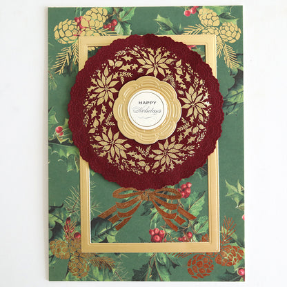 Holiday Nostalgia Foil Rub Ons feature gold and red poinsettias, a "Happy Holidays" label, pinecones, holly, and vintage shimmer on a green background—perfect for classic Christmas papercrafting.