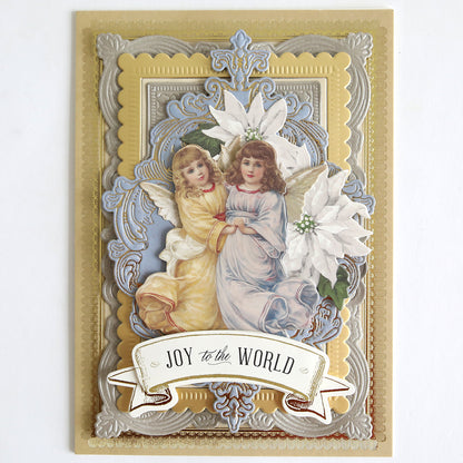 Holiday Nostalgia Embellishments feature vintage-style angels in yellow and blue robes, embossed gold and silver borders, white poinsettias, and a "JOY to the WORLD" banner—ideal for holiday crafts or as Christmas card decorations.
