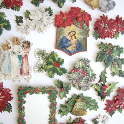 Holiday Nostalgia Embellishments features vintage-inspired Christmas cutouts—poinsettias, holly, bells, angels, a nativity scene, and a decorative frame—beautifully arranged on a white background.