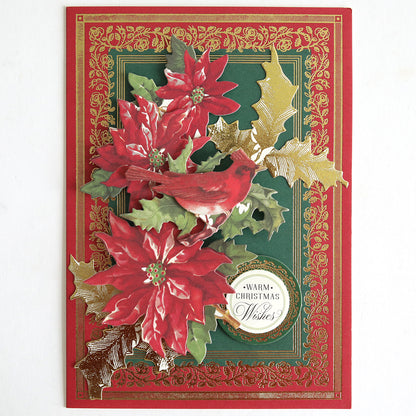 Holiday Nostalgia Embellishments: A vintage-style Christmas card with red poinsettias, a cardinal, gold holly leaves, and a "Warm Christmas Wishes" label on an ornate green and red background—ideal for festive paper crafts.