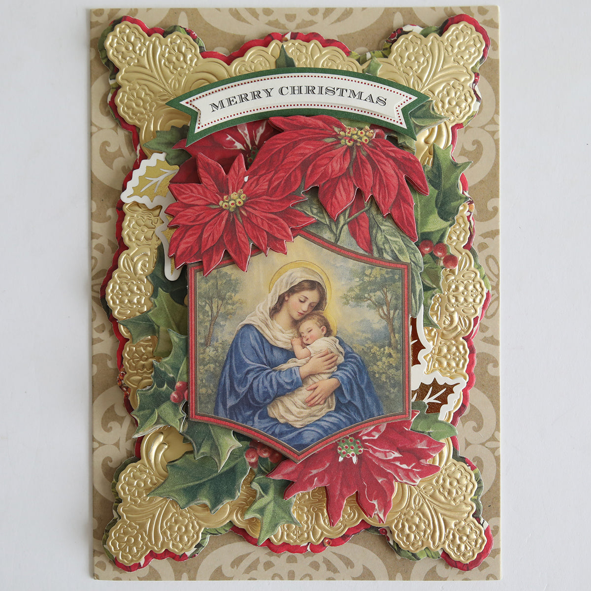 Send festive cheer with Holiday Nostalgia Embellishments—a vintage-inspired card kit featuring Mary and baby Jesus, red poinsettias, gold embossed florals, and a "Merry Christmas" banner—ideal for holiday paper craft lovers.