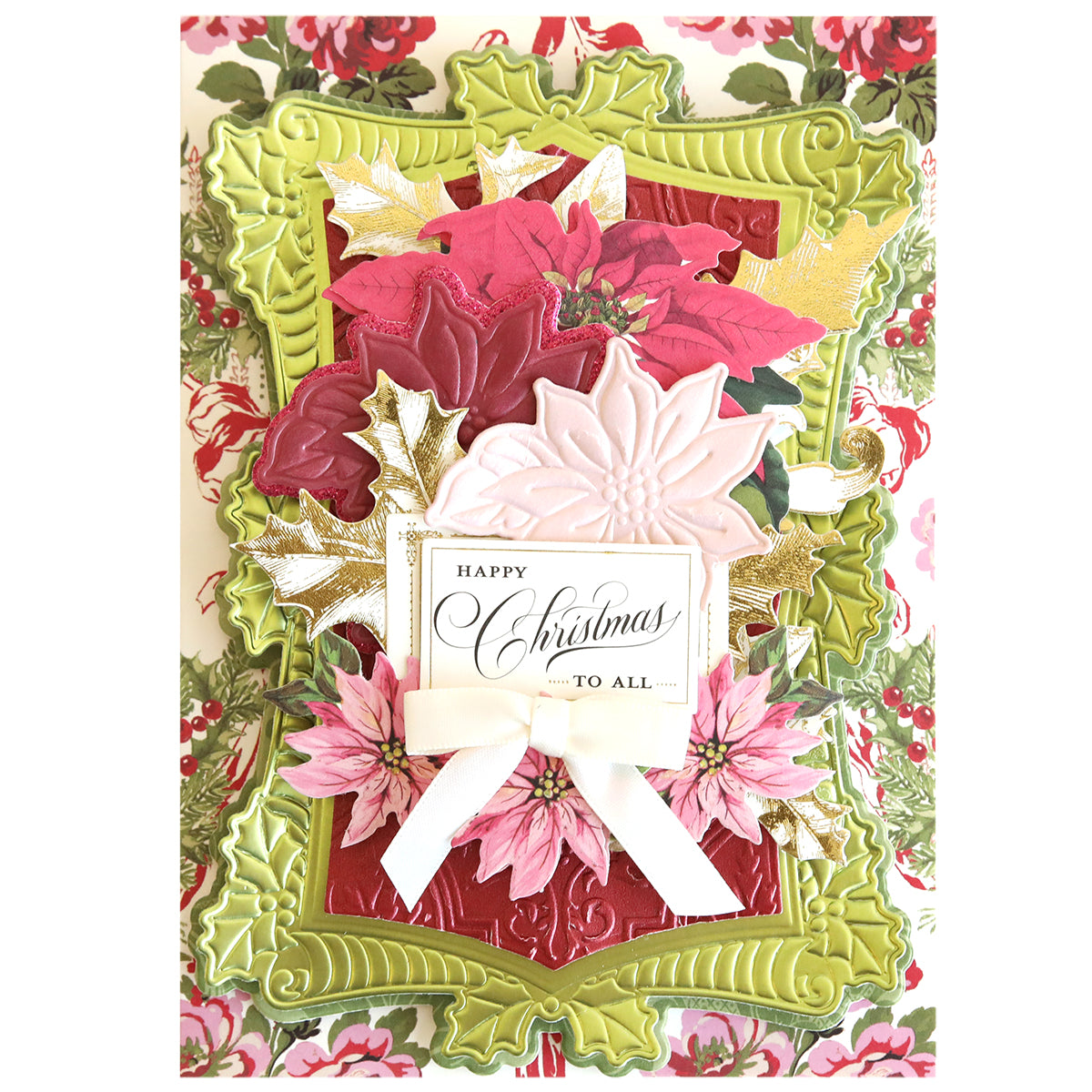 This Christmas card features layered florals, gold leaves, a white ribbon, and a "Happy Christmas to all" tag, beautifully framed by an ornate green border crafted with Poinsettia Scroll Frame 3D Dies.