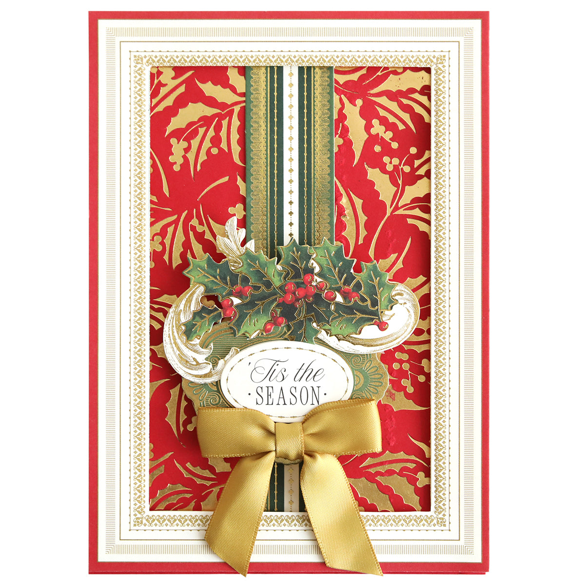 A festive card adorned with a gold and red Christmas Holly pattern, accented by a green vertical stripe, gold ribbon bow, and “’Tis the Season” text in an ornate frame. The elegant foiled backgrounds are crafted using the Gilded Christmas Holly Hot Foil Plate for an extra touch of holiday sparkle.