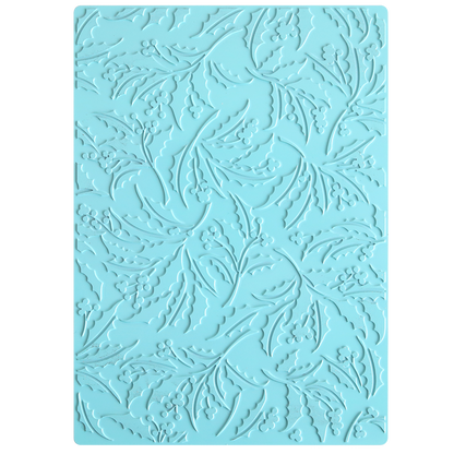 A blue rectangular mat featuring an embossed, swirling pattern of leaves and berries, inspired by a classic Christmas Holly motif—ideal for crafting elegant foiled backgrounds with the Gilded Christmas Holly Hot Foil Plate.