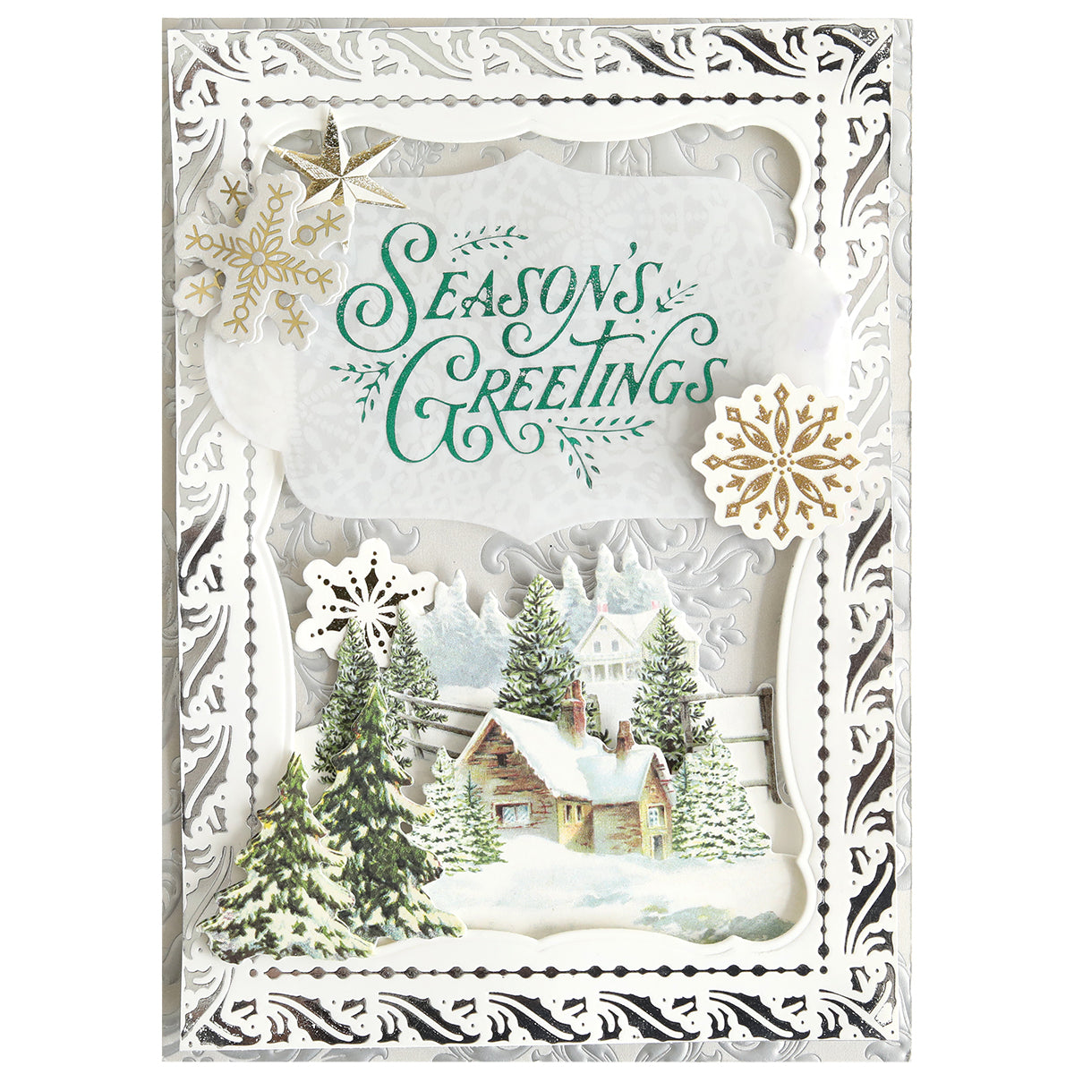 Send warm Christmas wishes with the Gilded Christmas Frame and Sentiments Hot Foil Plate, featuring "Season's Greetings" in green, snowflakes, snowy pine trees, a cottage scene, and an elegant silver border—ideal for handmade holiday cards.