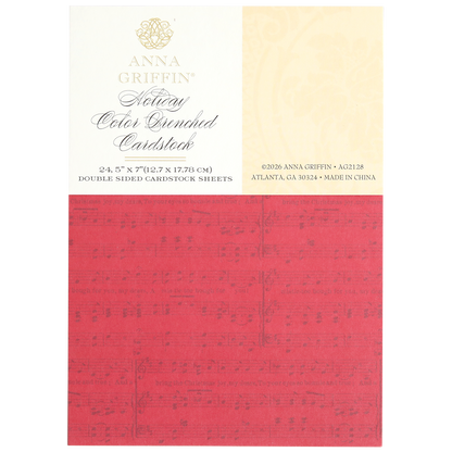 Red Holiday Color Drenched Cardstock sheet featuring subtle music note designs; this double-sided cardstock is ideal for Christmas card making. Product details and company information are displayed at the top of the packaging.