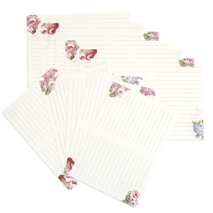 Seven Gratitude Journal Pages with floral corner designs, ideal as pre-printed or insert pages for your journal, displayed fanned out on a white background.