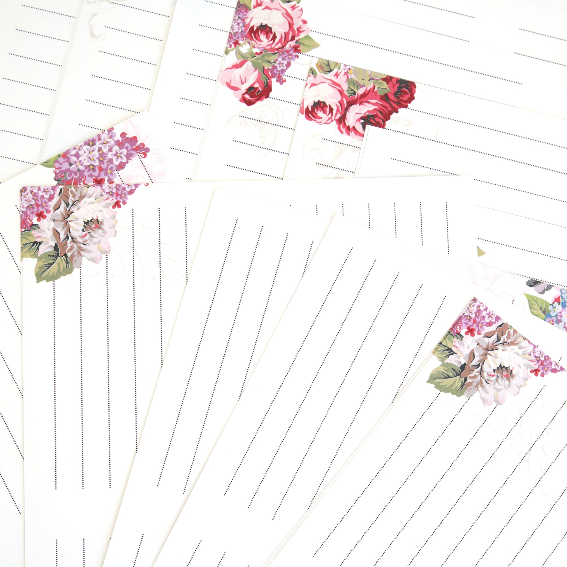 Gratitude Journal Pages feature floral corner designs and come pre-printed, fanned out on a white background—ideal as insert pages for your Gratitude journal.