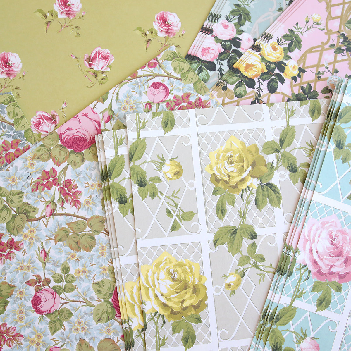 The Rose Cardstock Collection features assorted double-sided pastel sheets with floral and lattice designs—perfect for scrapbooking and paper crafts.