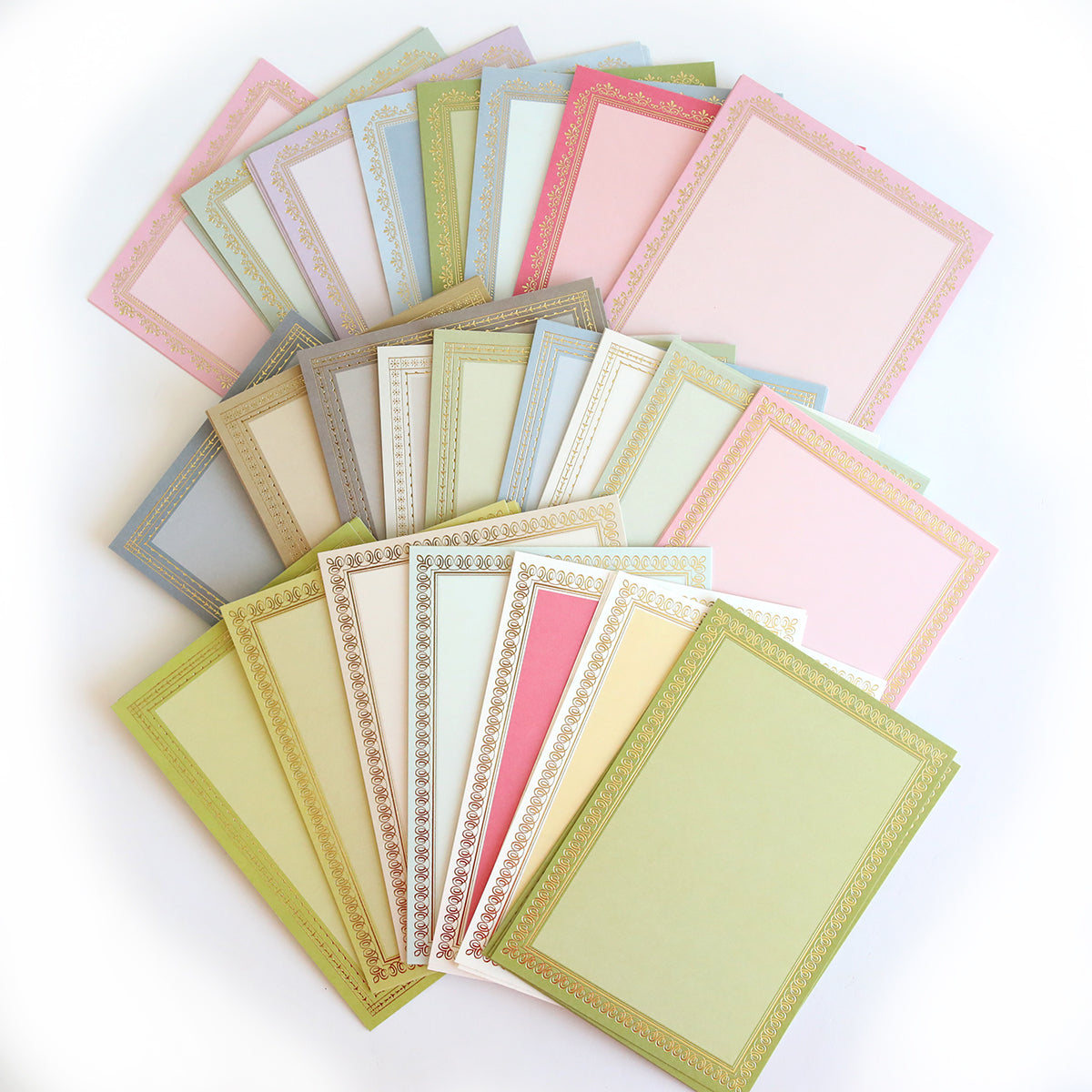 Timeless Photo Mats and Card Layers features pastel scrapbook pages and stationery sheets with ornate borders, artfully fanned out on a white background.