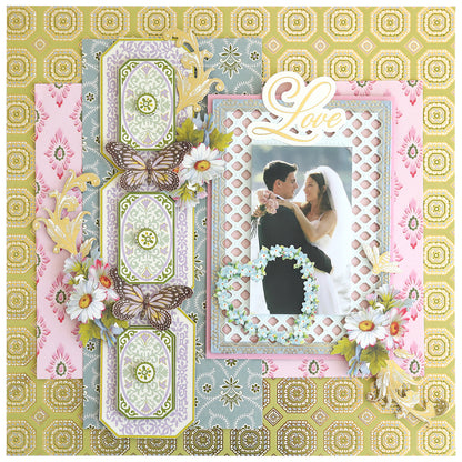 A wedding scrapbook page with Timeless Photo Mats and Card Layers, floral accents, butterflies, a bride and groom photo, and "Love" at the top right.