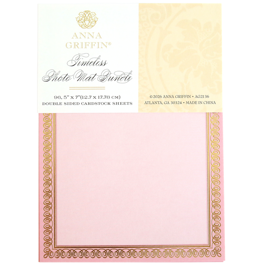 A package of Timeless Photo Mats and Card Layers includes pink and gold decorative 5" x 7" cardstock sheets, ideal for scrapbook pages, photo mats, or card layers. Each sheet is labeled with product and company details.