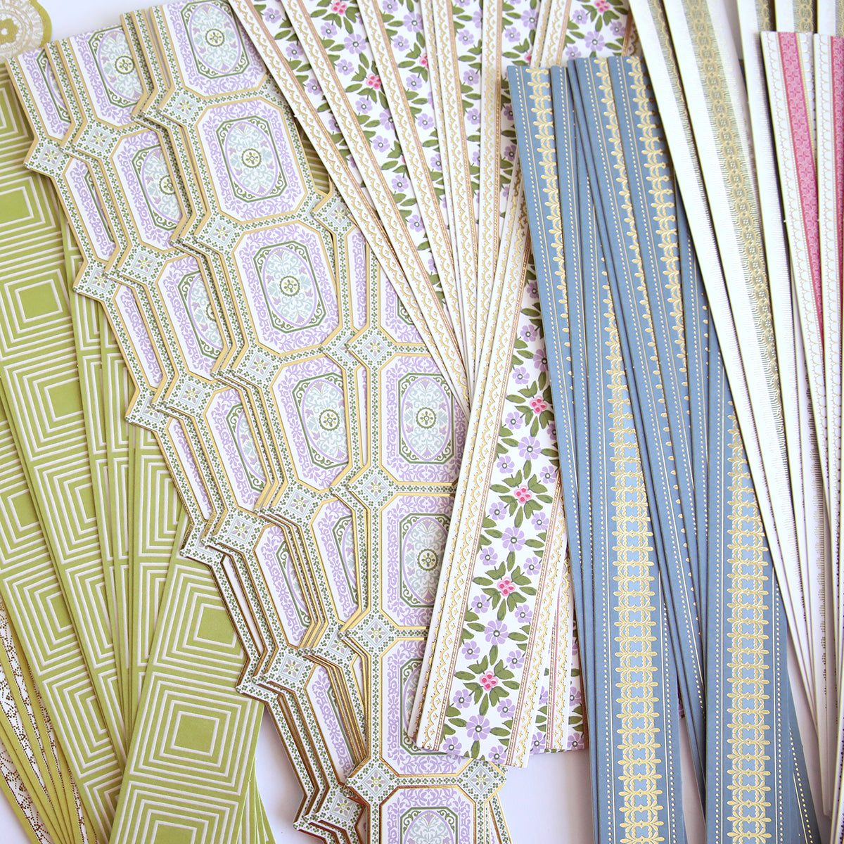 Timeless Border Stickers feature assorted decorative patterned strips in green, pink, blue, and gold. Perfect for scrapbook supplies or adding unique borders to crafts.