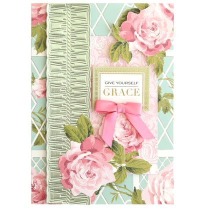 Rose Die Cut Embellishments feature pink roses, a green ribbon, a pink bow, and “Give Yourself Grace” on a pastel patterned background—ideal for card making or scrapbooking with rose-themed accents.