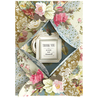 Crafted with Turned Edge Dies, this floral card has dimensional designs and folded flaps that open to reveal a center message: "Thank you ever so much.