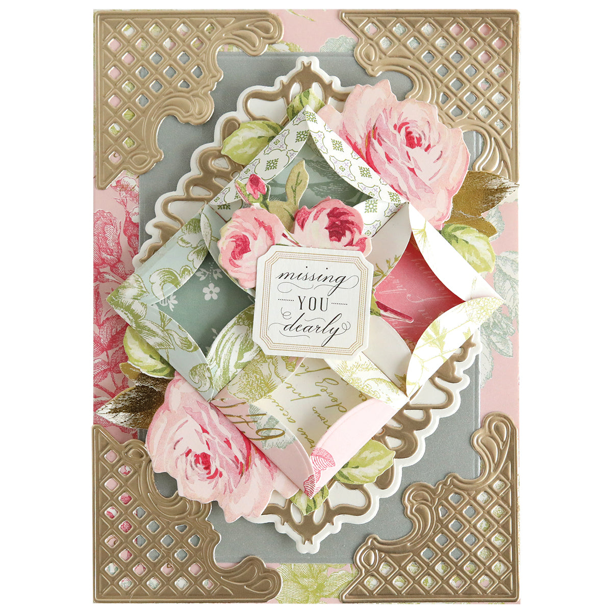 A floral greeting card made with Turned Edge Dies features pink roses, gold accents, an envelope with "missing you dearly" at the center, and elegant dimensional details for a refined finish.