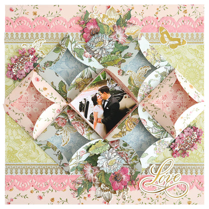 A scrapbook page showcases a bride and groom photo, with folded floral papers, lace accents made using Turned Edge Dies, and a "Love" embellishment in one corner.