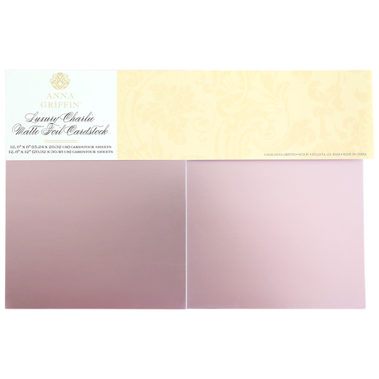 Luxury Charlie Matte Foil Cardstock in light pink comes in a pack with two rectangular sheets side by side, ideal for elegant die cuts and sophisticated crafting projects.