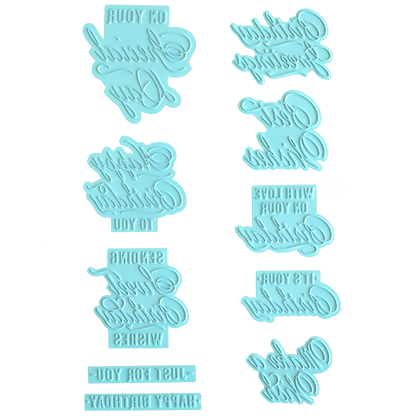 Thirty gilded small sentiment plates, featuring reversed birthday phrases, arranged vertically on a white background—perfect for pairing with the Set of 30 Gilded Small Sentiment Plates.