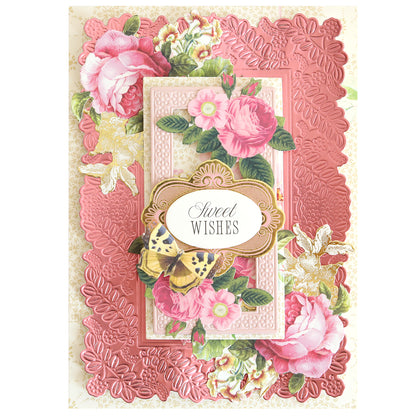 A pink floral greeting card with embossed, die-cut roses, leaves, a butterfly, and "Sweet Wishes" label, crafted using Happy 3D Frame and Border Dies for an elegantly detailed finish.