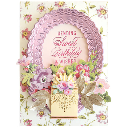A floral birthday card with a pink ornate frame, gold leaves, and “Sending Sweet Birthday Wishes” written in the center, beautifully accented using the Set of 30 Gilded Small Sentiment Plates for an elegant finish.