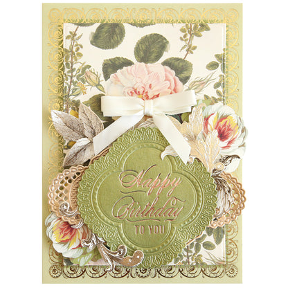 Handcrafted birthday card featuring elegant floral designs and gold accents created with the Gilded Small Birthday Sentiment Foil Plates, finished with a white ribbon. The card displays the message “Happy Birthday to you.”.
