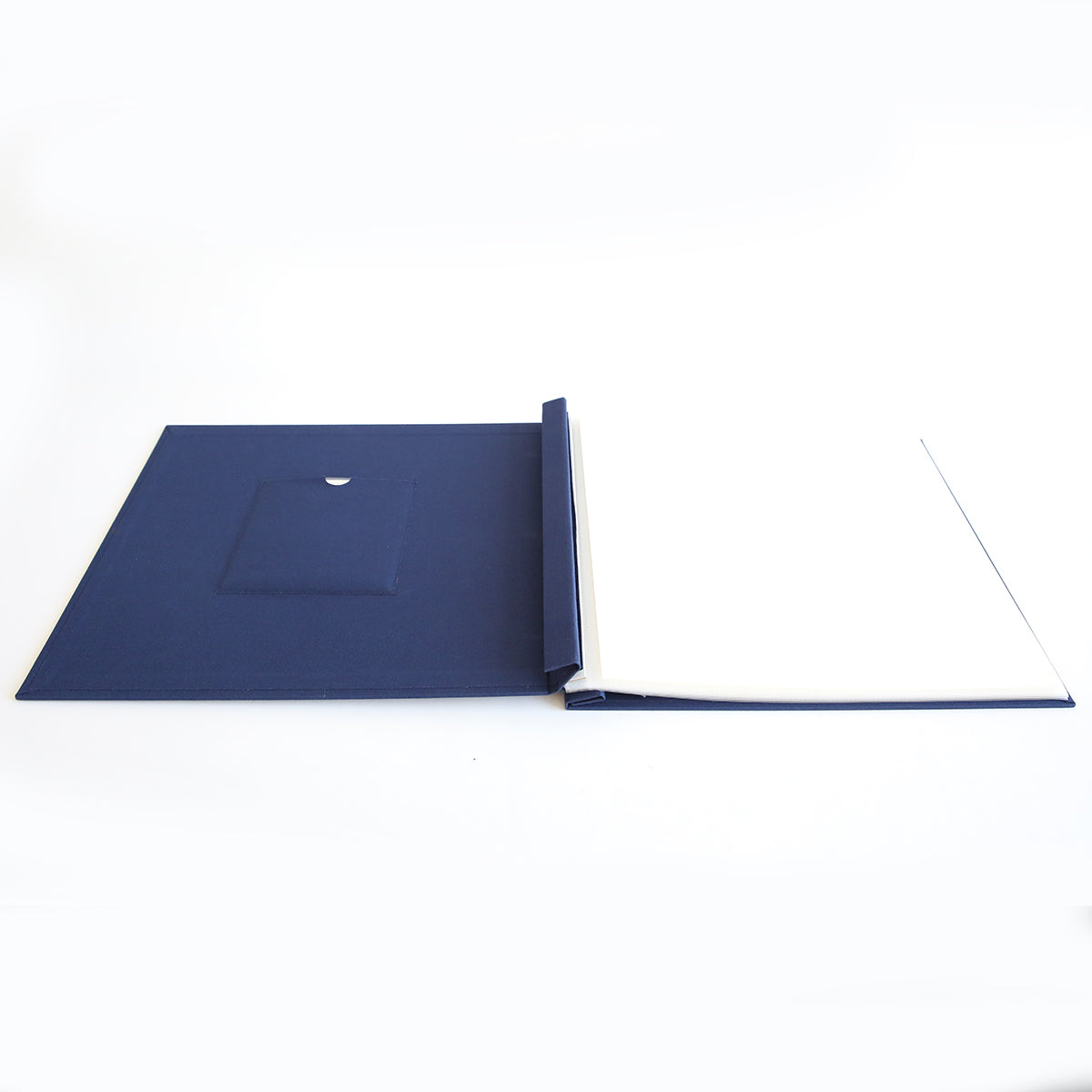 The Jack Navy Post Bound Scrapbook Album is a blue hardcover folder with a left pocket and blank white pages on the right—ideal for creating photo albums or scrapbooking layouts.