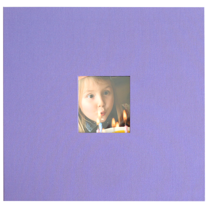 A young child blows out candles on a birthday cake in a small square photo, centered on a plain lavender background—ideal for displaying in your Charlie Purple Post Bound Scrapbook Album.