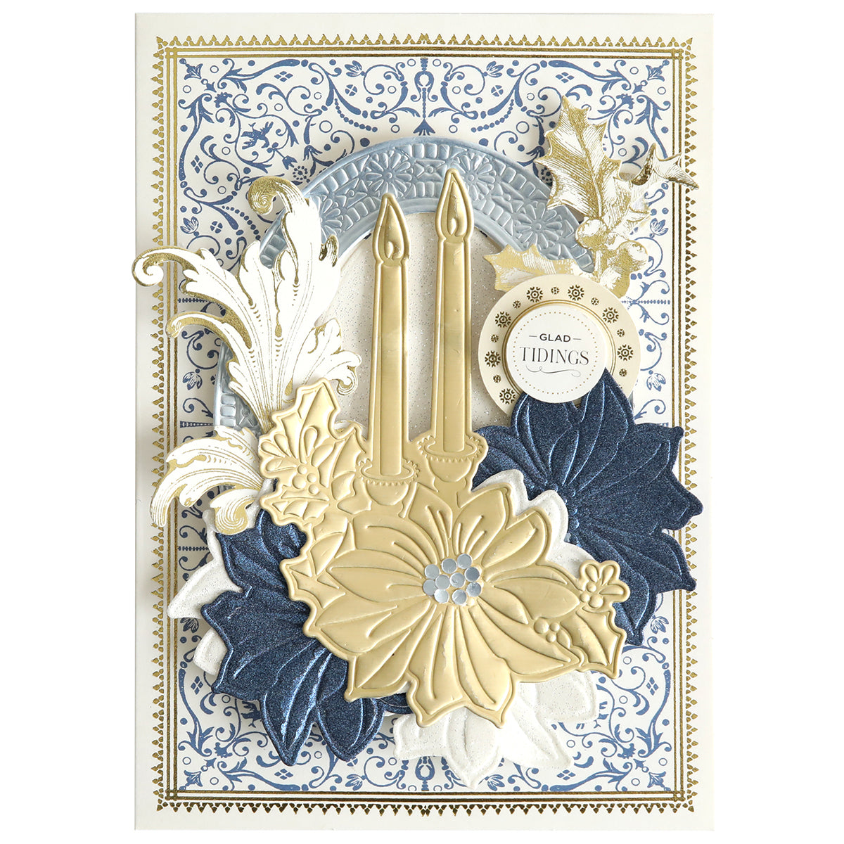 Create stunning layered Christmas cards with the 3D Holiday Candlelight Scene Dies, featuring two gold candles, gold and blue flowers, ornate flourishes, and a "Glad Tidings" tag set against an intricate blue and white patterned background—perfect for paper crafting enthusiasts who love decorative designs.