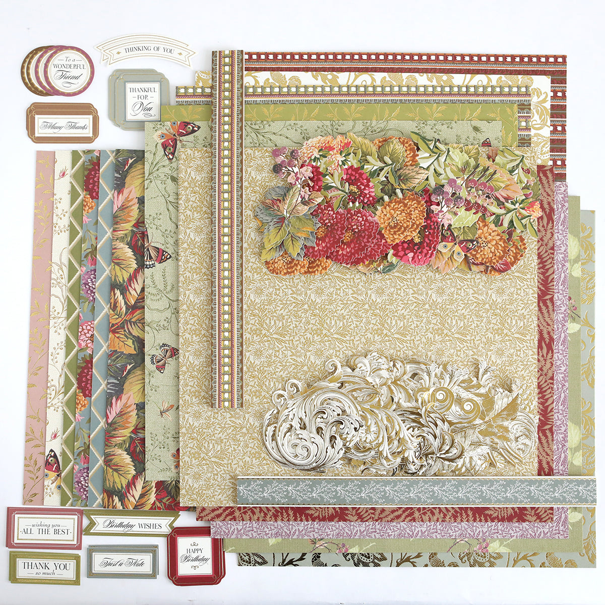 The Sienna Cardstock and Embellishments set features patterned scrapbook papers with floral, leaf, and ornate designs, paired with a variety of decorative greeting labels and tags—perfect for autumn paper crafting or bringing a seasonal flair to your Thanksgiving scrapbook projects.