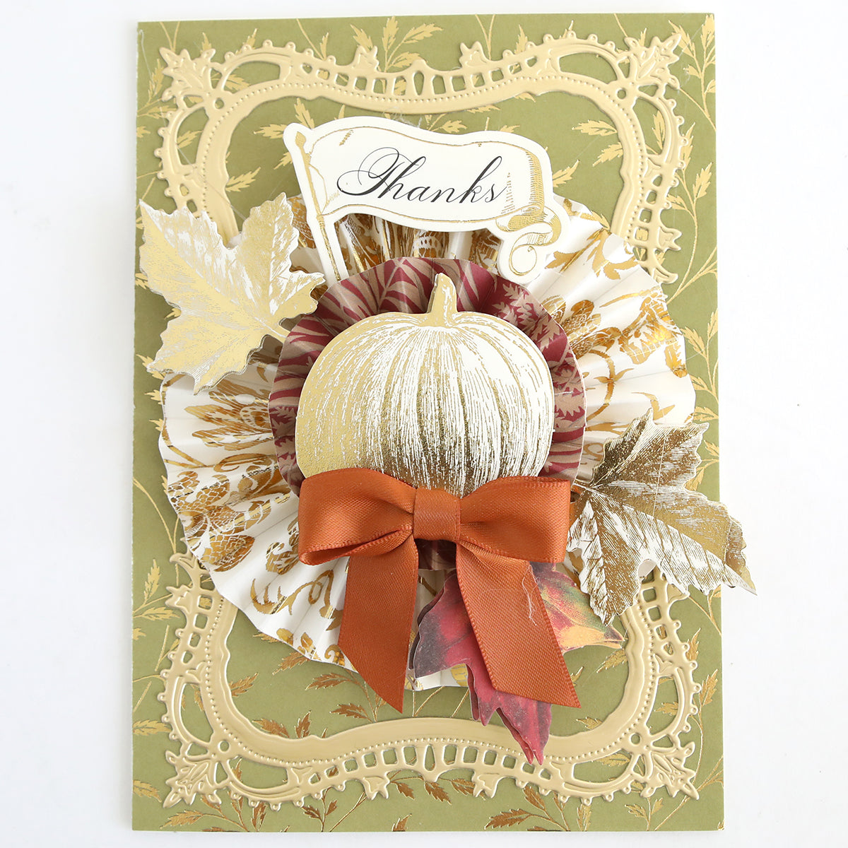Add charm to your seasonal paper crafts or Thanksgiving cards collection with the Fall Ephemera Embellishments. This set includes a greeting card adorned with a white pumpkin, orange bow, gold leaves, and a “Thanks” sign on an ornate green and gold background—perfect for creating elegant autumn designs.