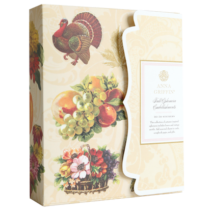 Housed in a box adorned with charming illustrations of a turkey, fruit, and flowers and labeled “Anna Griffin Fall Ephemera Embellishments,” this set is perfect for your seasonal paper crafting or for designing stunning Thanksgiving cards. Each box includes exquisite embellishments to elevate all your autumn-themed projects.